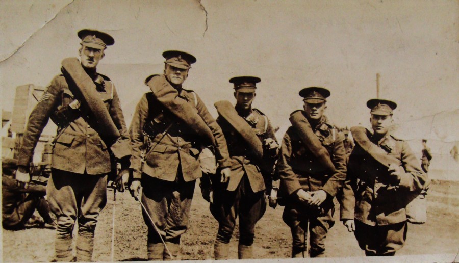 Volunteers from the 5th Regiment leaving for Petawawa as part of the 15th Brigade Canadian Field Artillery. Original notes name them, from left to right, as Ross, Pellow, Patterson, Christensen, and Ware.
